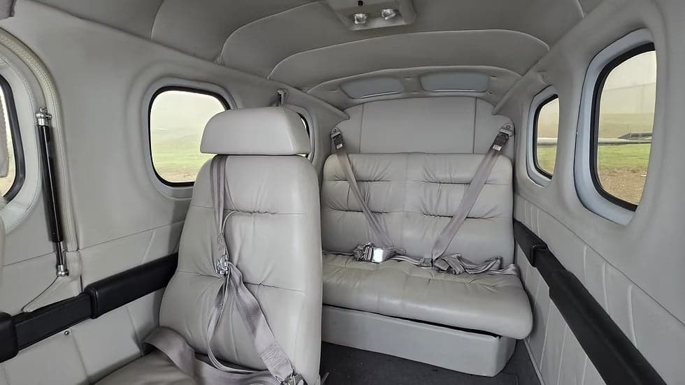 The aircraft's interior showing the rear seating arrangement.