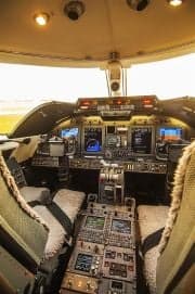 View of the Learjet cockpit instrument panel from the seats.