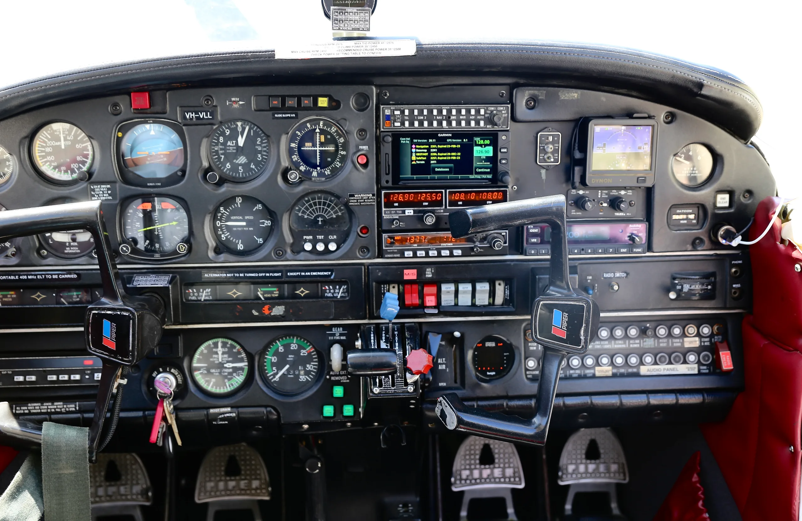 Detailed view of the Piper Archer II cockpit instrument panel.