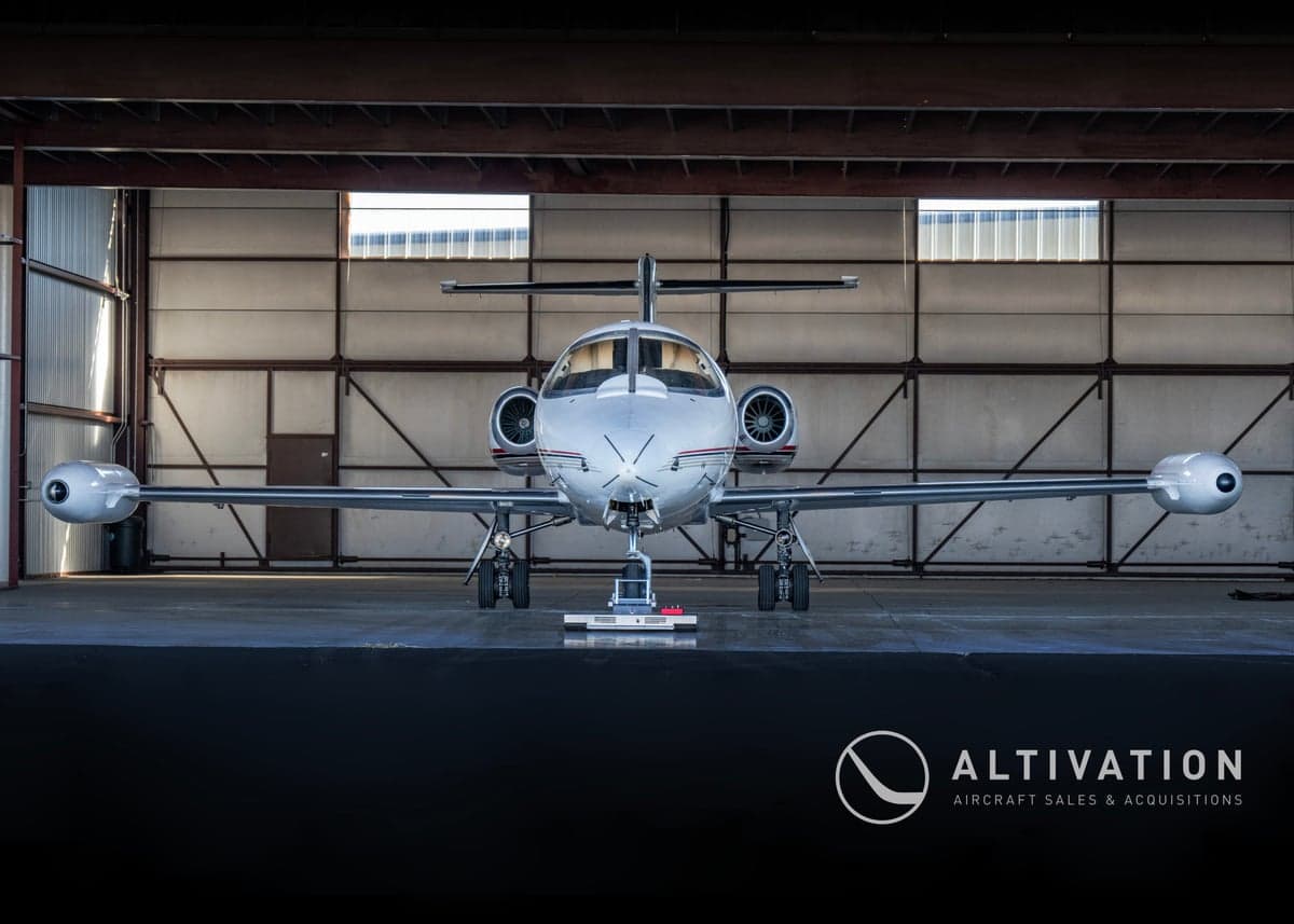 A Learjet in a hangar with the tail number N752EA.