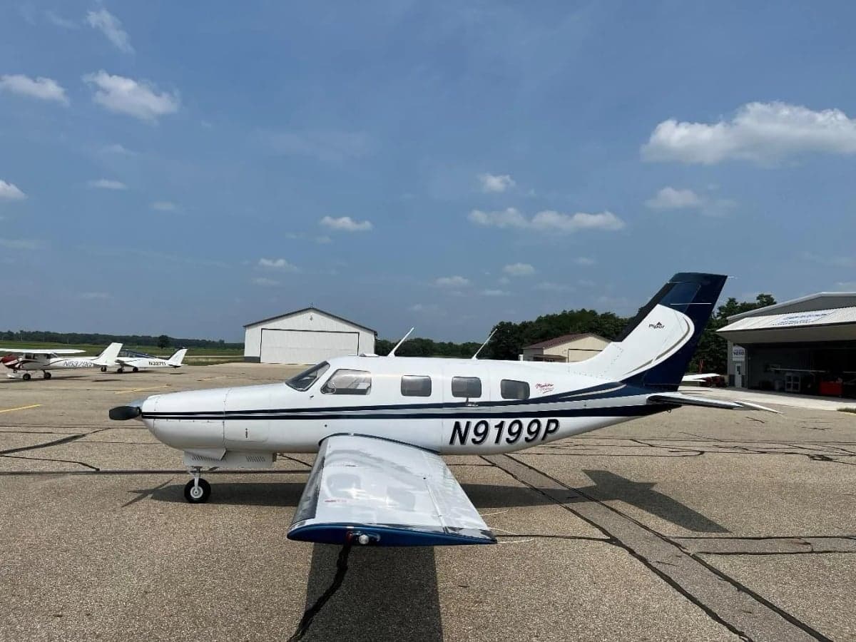 Side view of the Malibu Mirage aircraft N9199P on the tarmac.