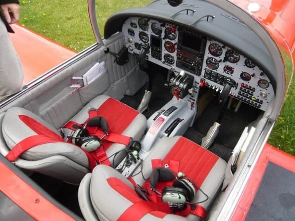 Close-up of the engine compartment of a red aircraft, HB-EML.