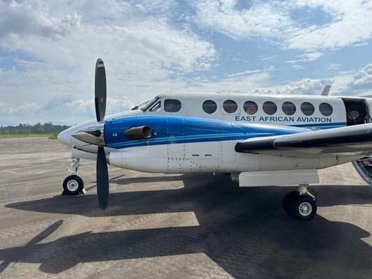 Close-up of the King Air aircraft's nose and propeller, showing the East African Aviation livery.