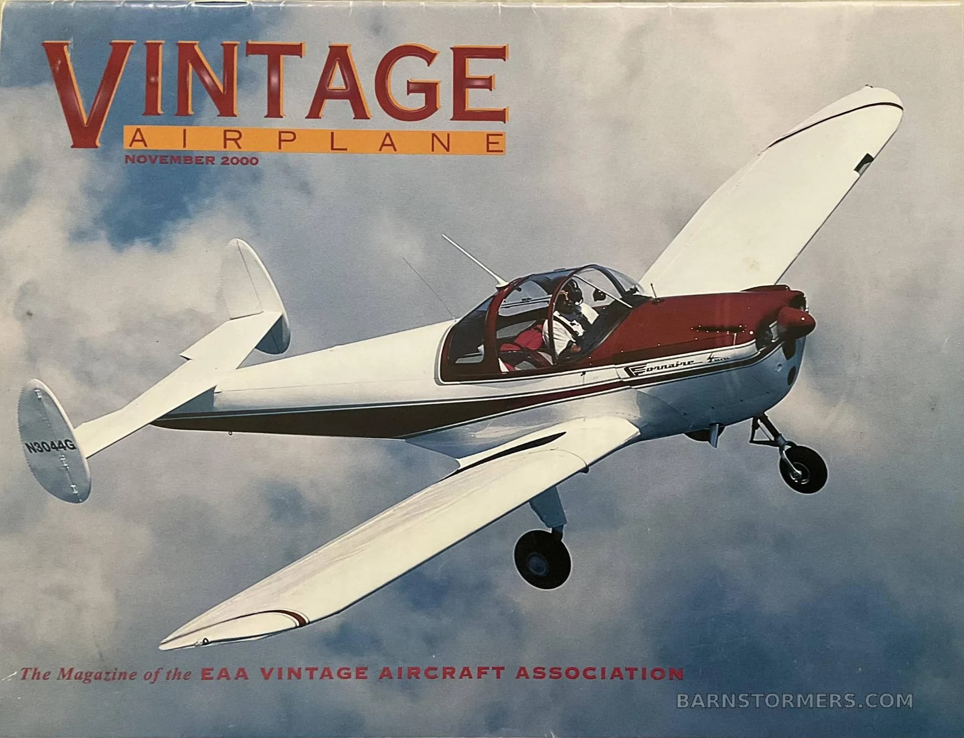 A white and maroon Ercoupe 415-C aircraft with tail number N304G is shown in flight on a magazine cover.