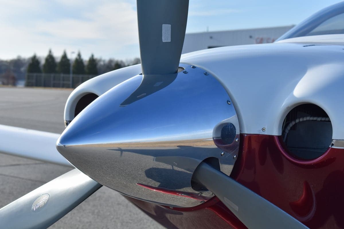 Close up of the propeller and front of the Lancair Columbia 350 aircraft.
