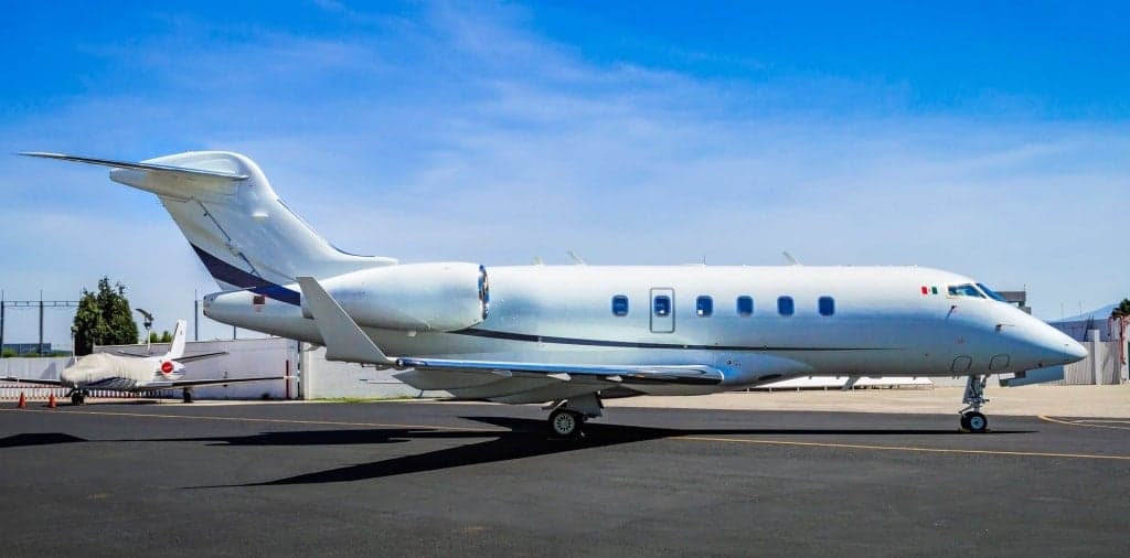 A Bombardier Challenger 300 parked on the tarmac.