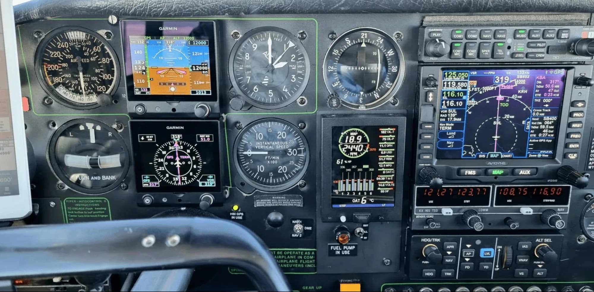 Close-up of the instrument panel of a Piper Comanche 250.
