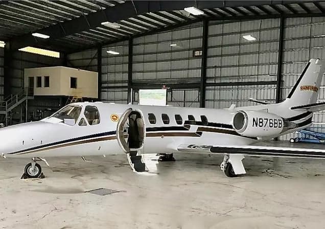 Citation CJ3 aircraft with registration N185VP in front of a hangar.