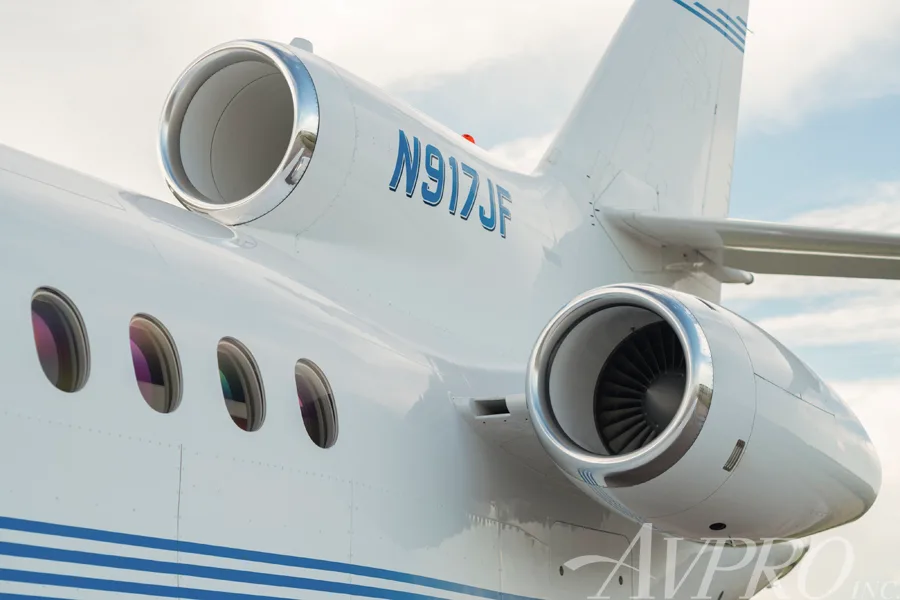 A close-up view of the tail number N917JF and two of the three engines on the Dassault Falcon 900EX.