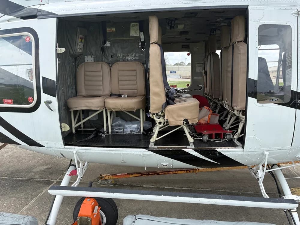 Interior view of the helicopter cabin with seats.