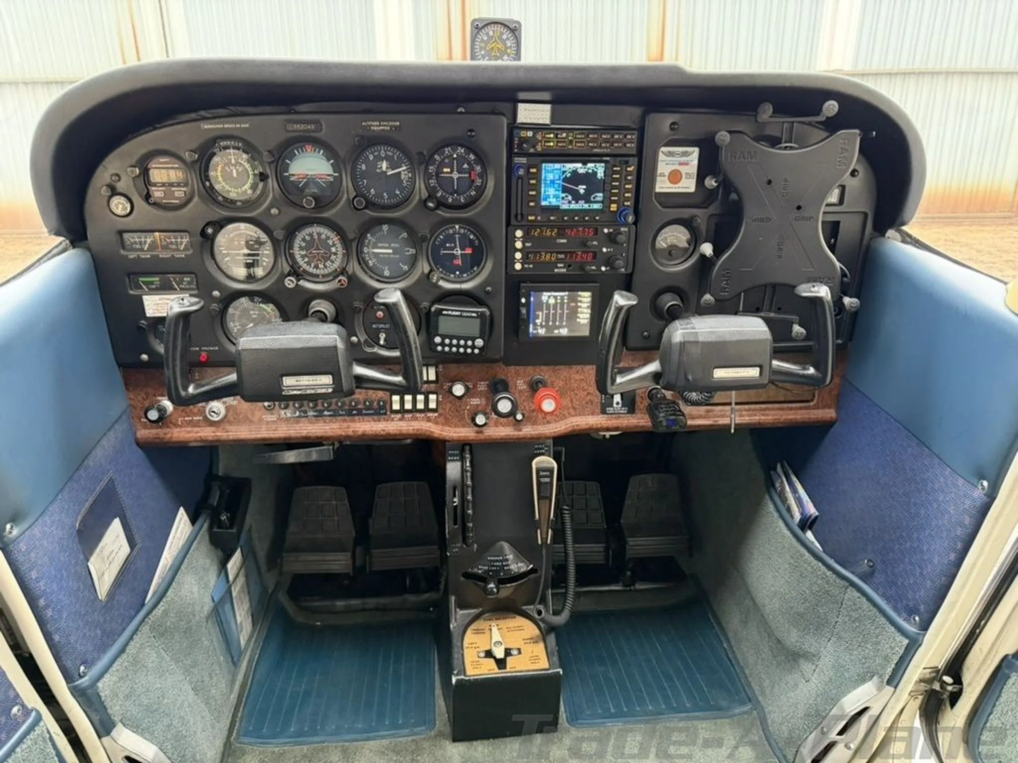 The cockpit of a Cessna 172, featuring a detailed instrument panel with analog gauges and modern digital displays.