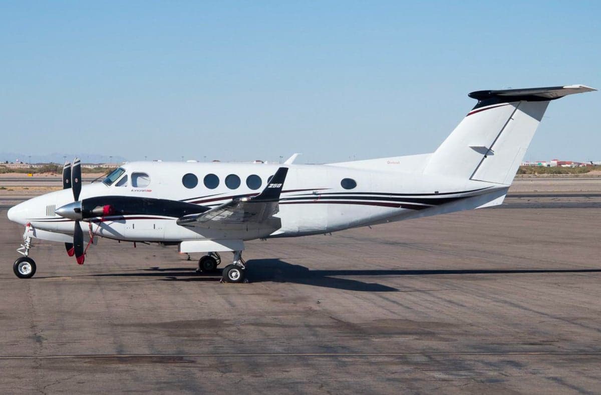 Side view of a King Air 250 on the tarmac.