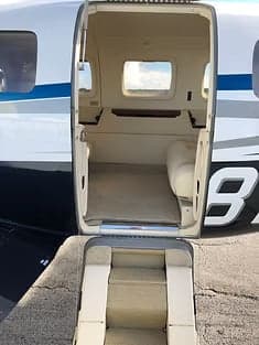 The cockpit of the Piper M600 featuring the instrument panel and sheepskin seat covers.