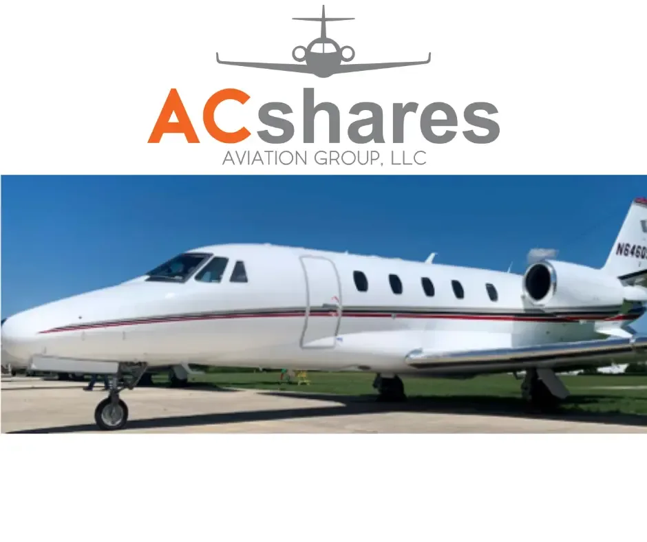 A white business jet with red and black stripes, registration N6460J, parked on an airfield under a clear blue sky, with an ACshares logo overlaid.