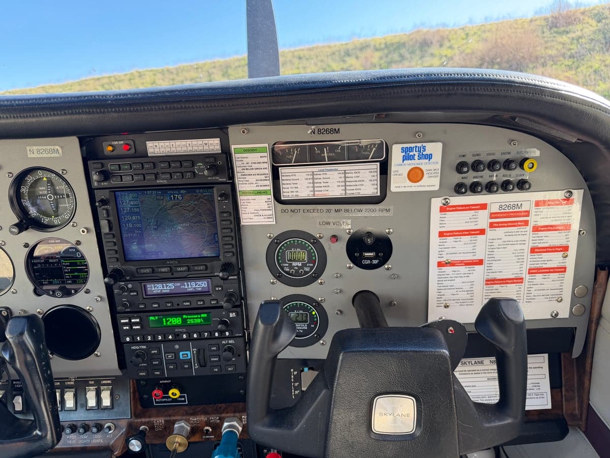 The cockpit of the N8268M aircraft, showing the instrument panel with various controls and displays.