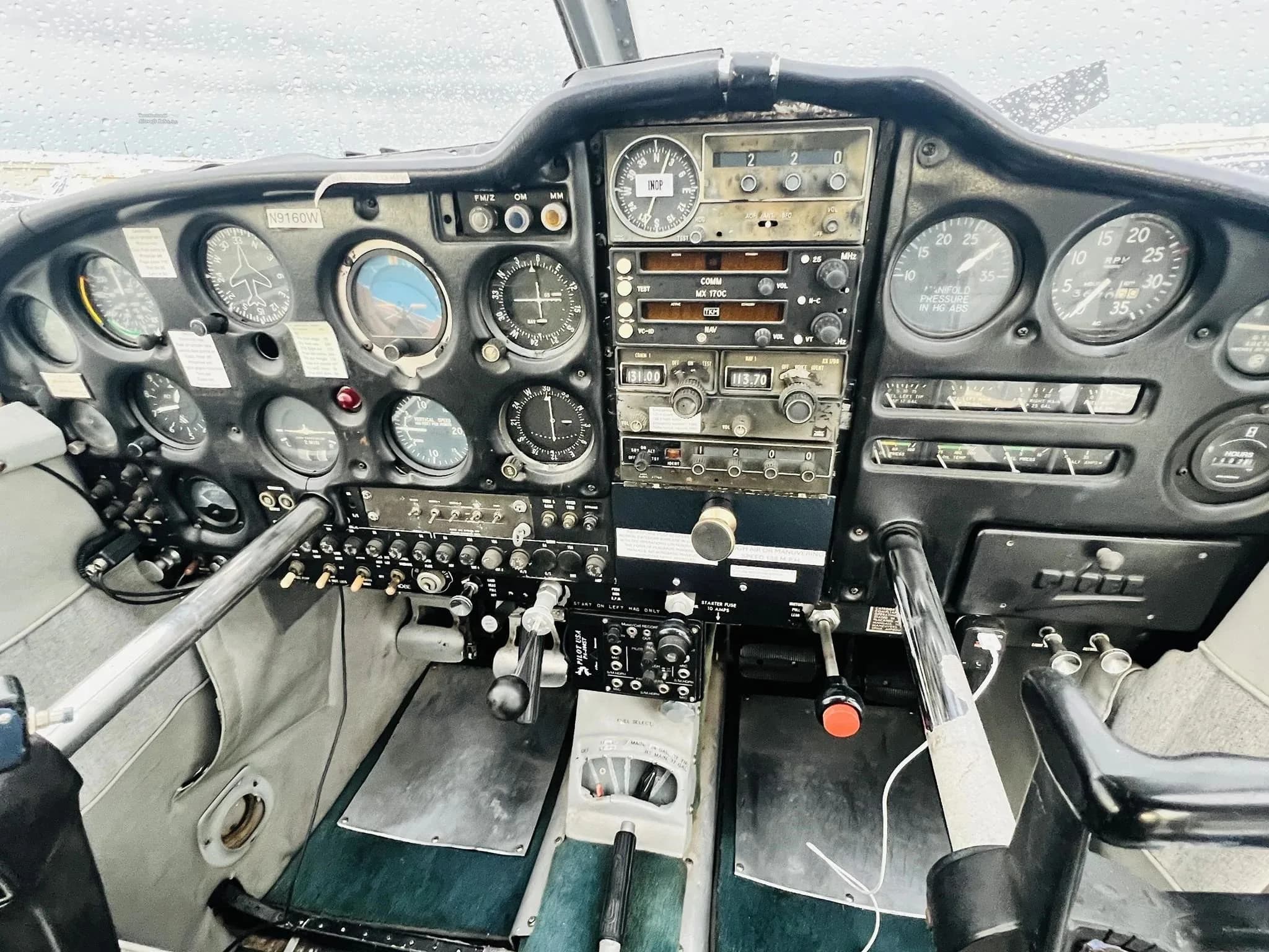 View of the instrument panel and controls in the cockpit of the Piper Cherokee 235 B.