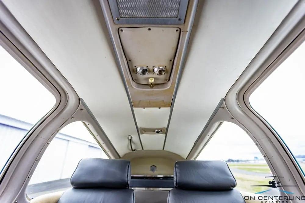 View of the cabin ceiling and seats of the aircraft.