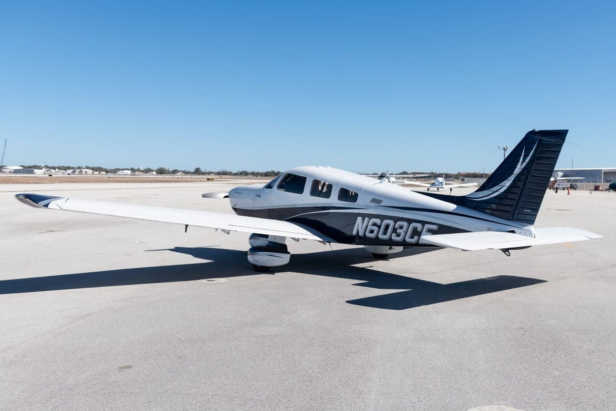 Side view of the Piper Archer LX N603CE on the tarmac.