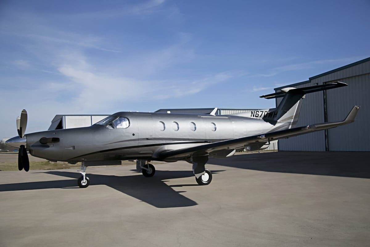 Pilatus PC-12 aircraft with registration N670WH parked on the tarmac.