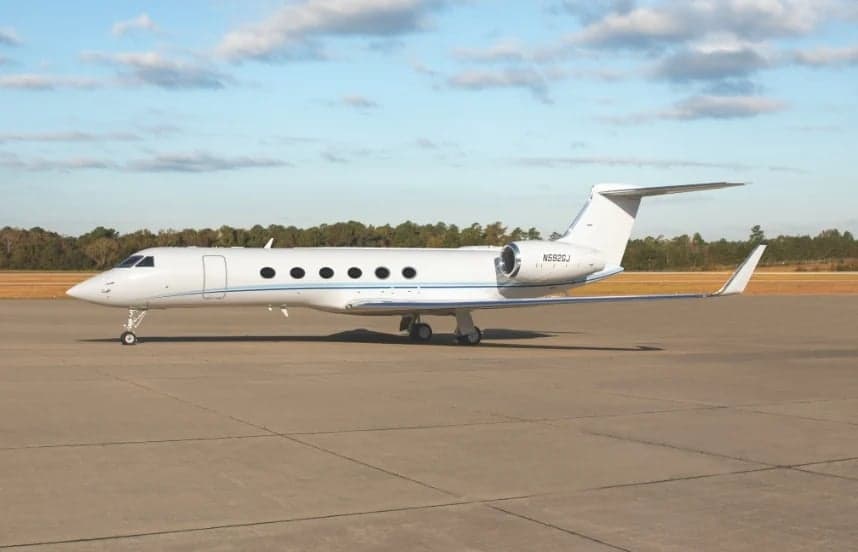 Side view of the N592GJ aircraft on the tarmac.