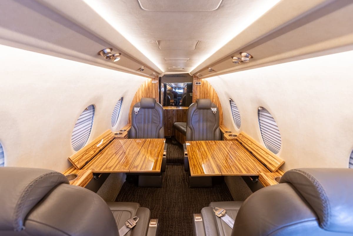 The interior of a Learjet 45XR features leather seats and wood accents.