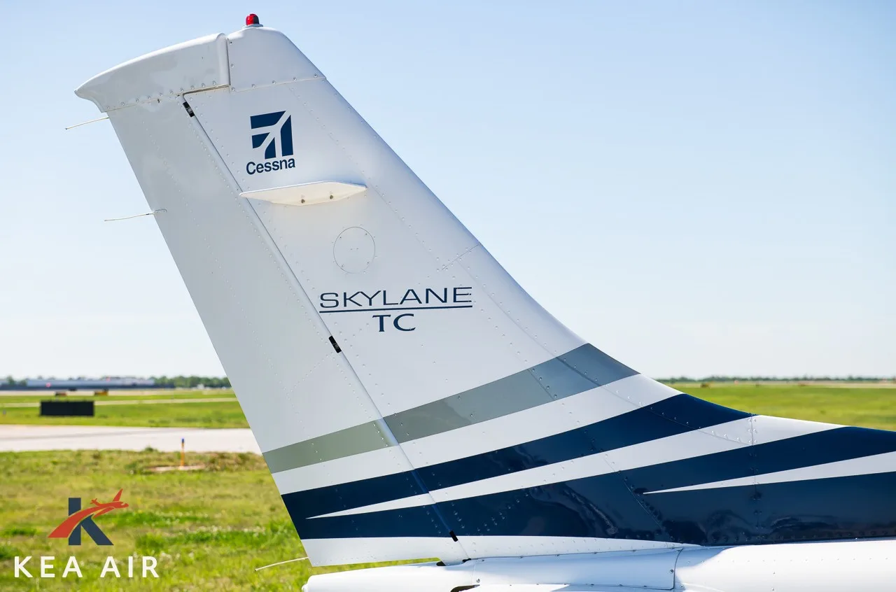 Close-up of the tail of the Cessna 182 Skylane, showing the Cessna logo and Skylane TC designation.