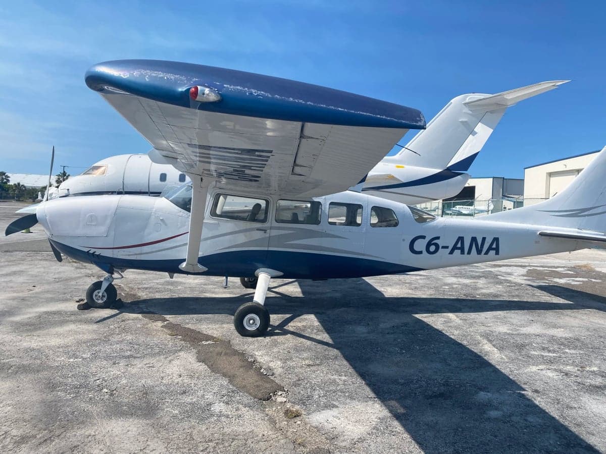 C6-ANA Cessna aircraft parked on the tarmac.