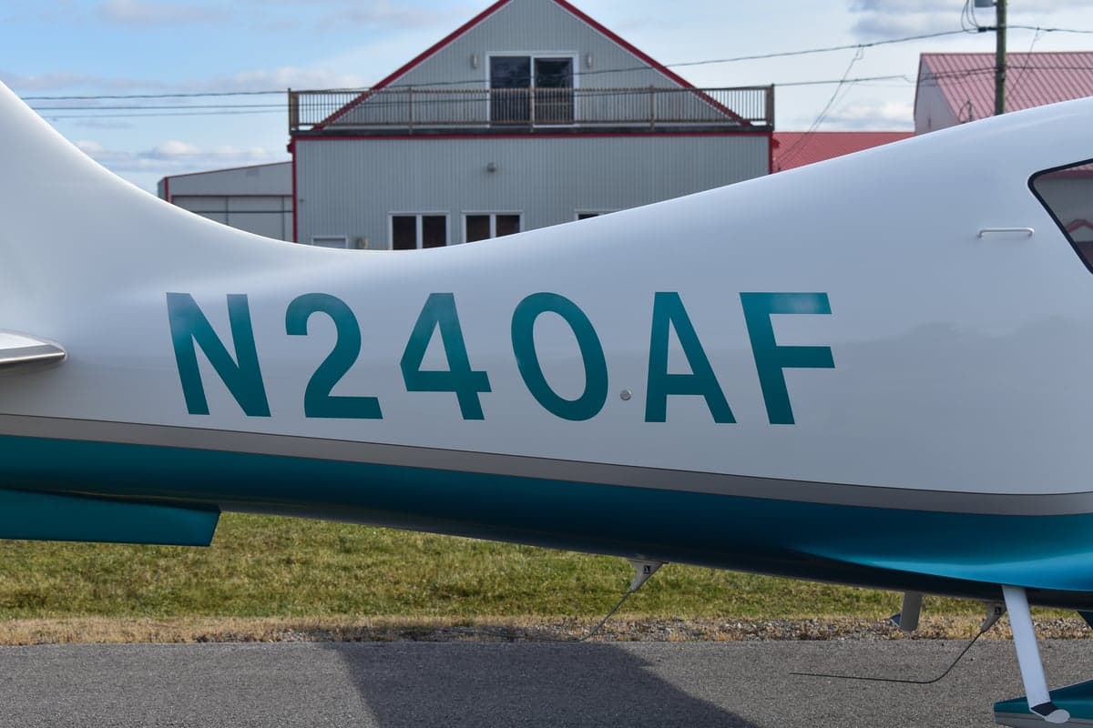 Rear view of Columbia 400 aircraft N240AF on the ground.