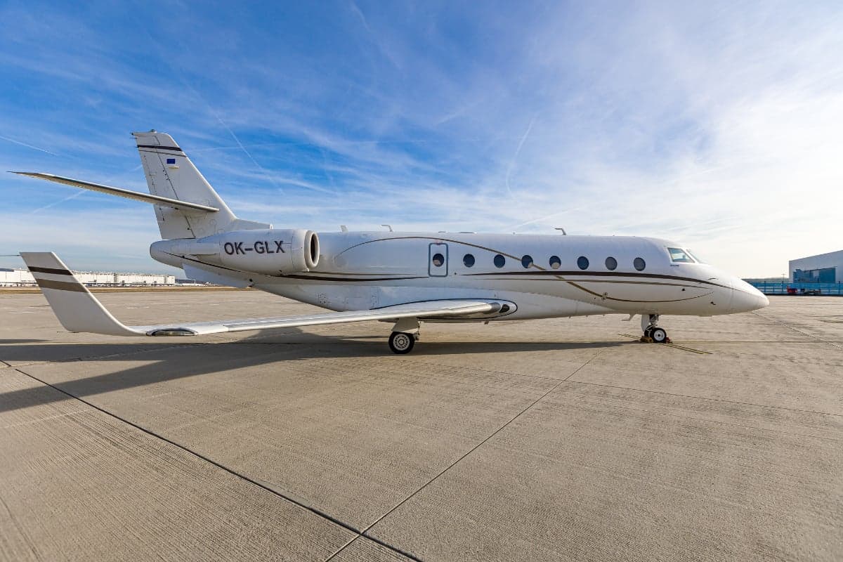 Gulfstream G200 aircraft with the tail number OK-GLX parked on the tarmac.