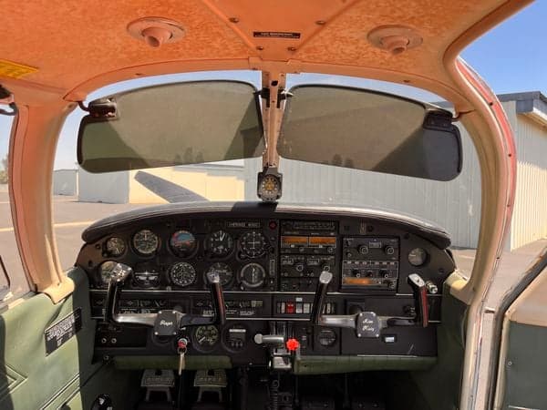 Pilot's view of the Cherokee 16320 instrument panel with sun visors.