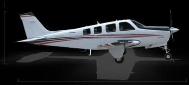 Front view of a light aircraft with a black background.