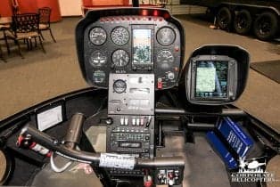 Instrument panel and controls of a helicopter cockpit.