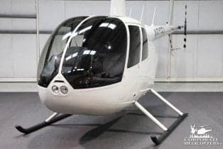 Front quarter view of a Robinson R44 helicopter.