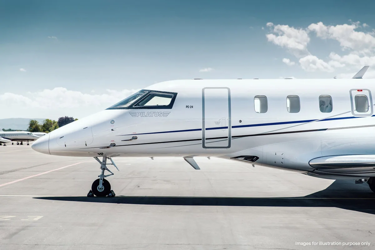 Close up of the front of a Pilatus PC-24 on the tarmac.