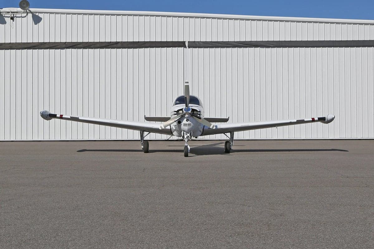 Front view of a Beechcraft Bonanza on the tarmac.