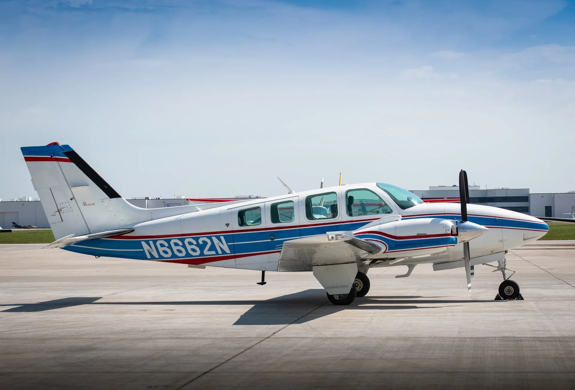 Side view of Beechcraft Bonanza N6662N on the tarmac.
