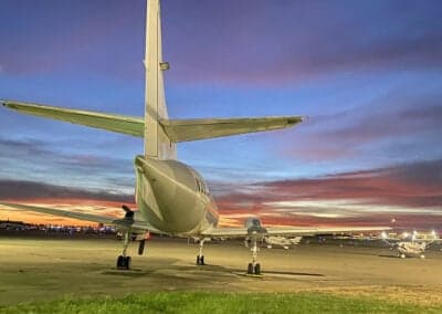 The tail of a Metro aircraft at dusk.