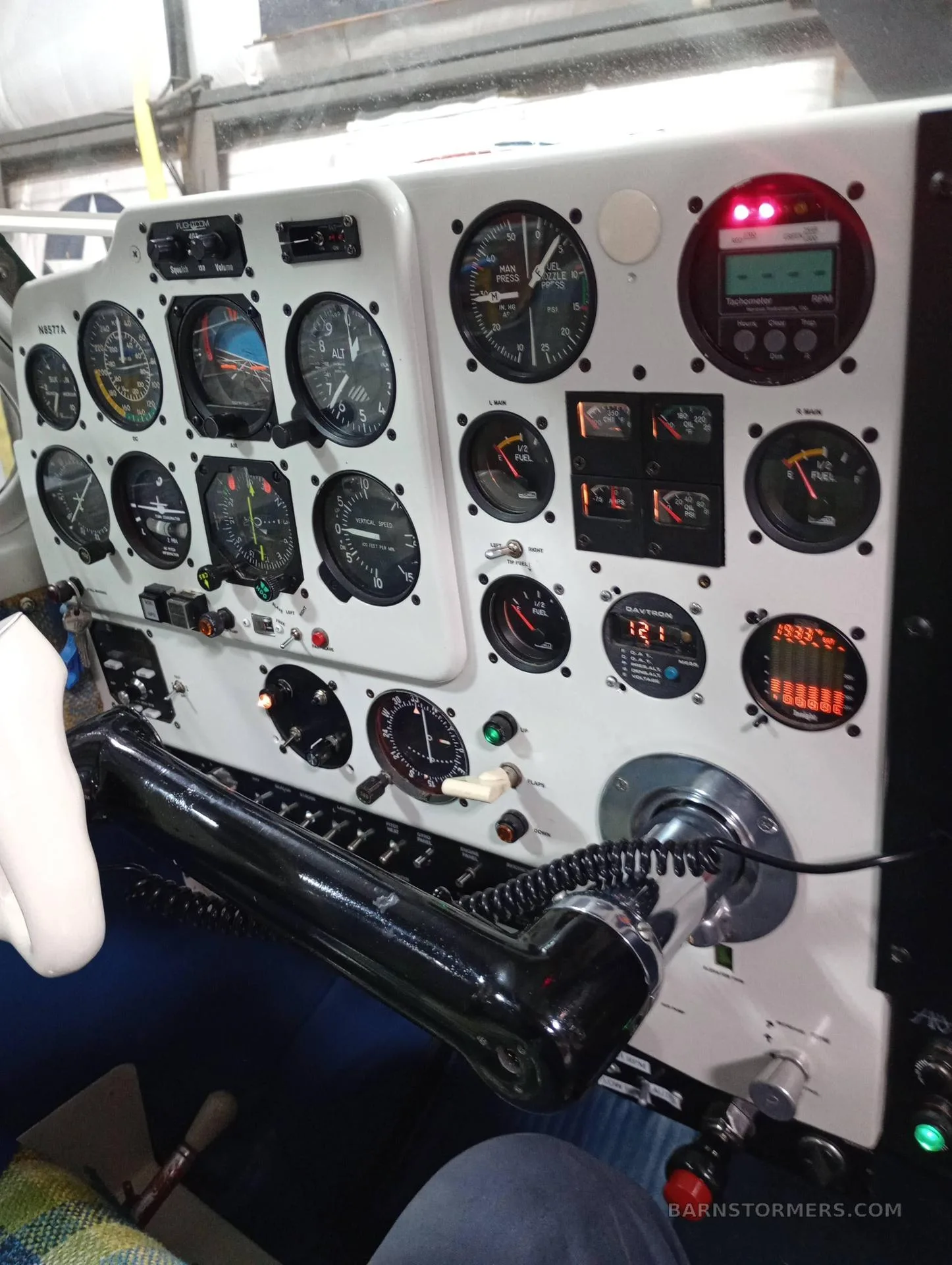 A close-up view of the aircraft's instrument panel with various gauges and controls.