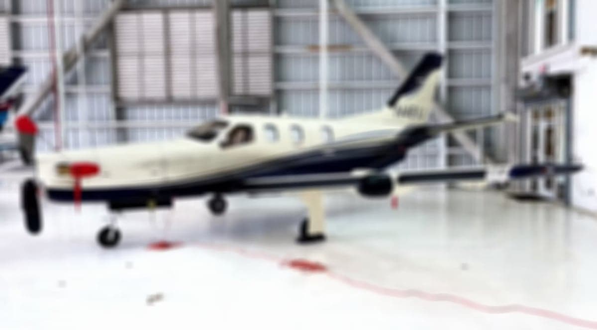 The cockpit features a Garmin avionics suite.