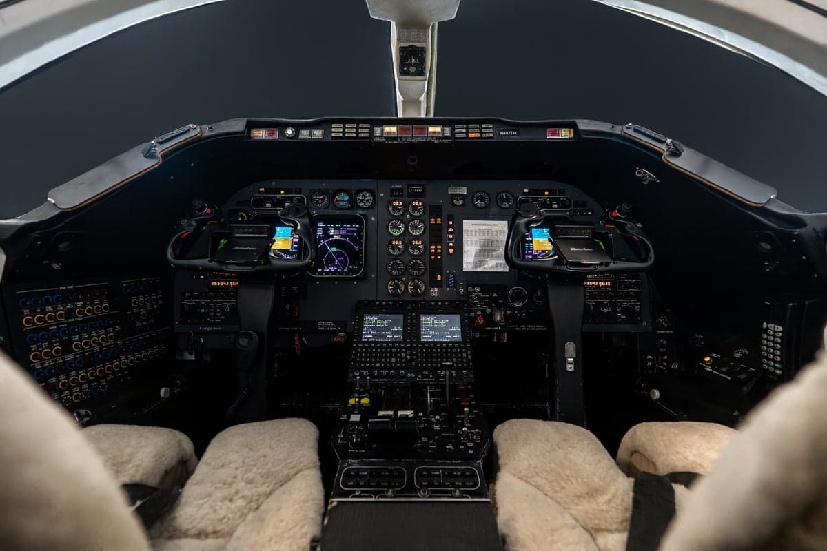 Detailed view of the Learjet cockpit instrument panel.