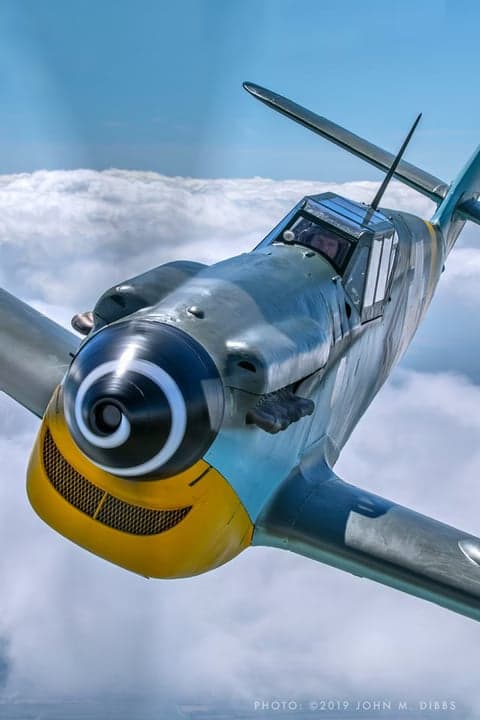 Aerial view of two Messerschmitt Bf 109 aircraft on a tarmac.