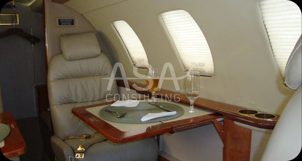 A table set for a meal inside the aircraft cabin.