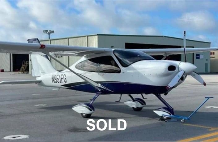 Side view of the N951FG aircraft on the ground with SOLD overlay.