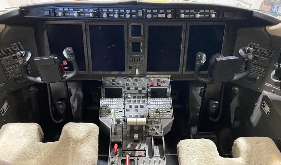 Detailed view of the aircraft's cockpit instrument panel and controls.