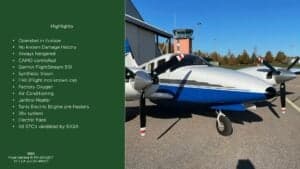 A Piper Seneca III PA-34-220T aircraft with registration SE-LCA parked in front of a hangar.