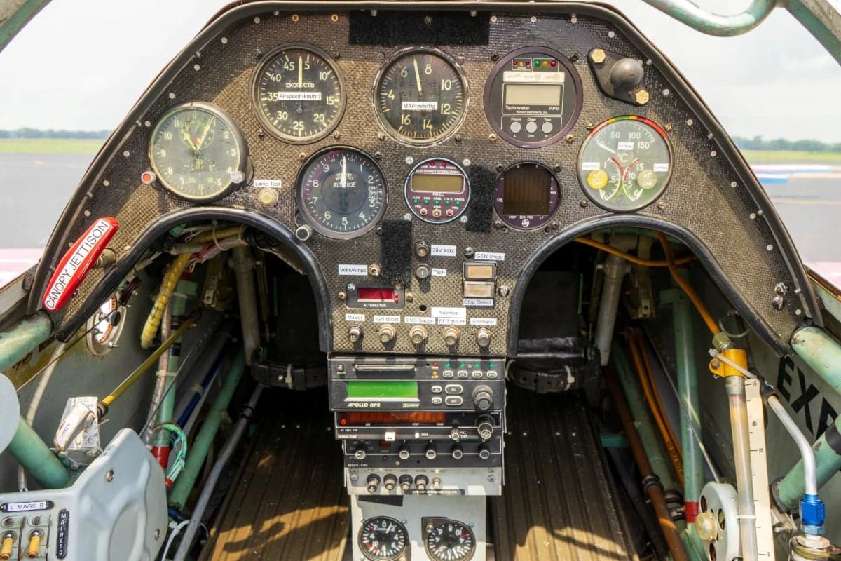 Close-up of the instrument panel and controls inside the cockpit of an aircraft.