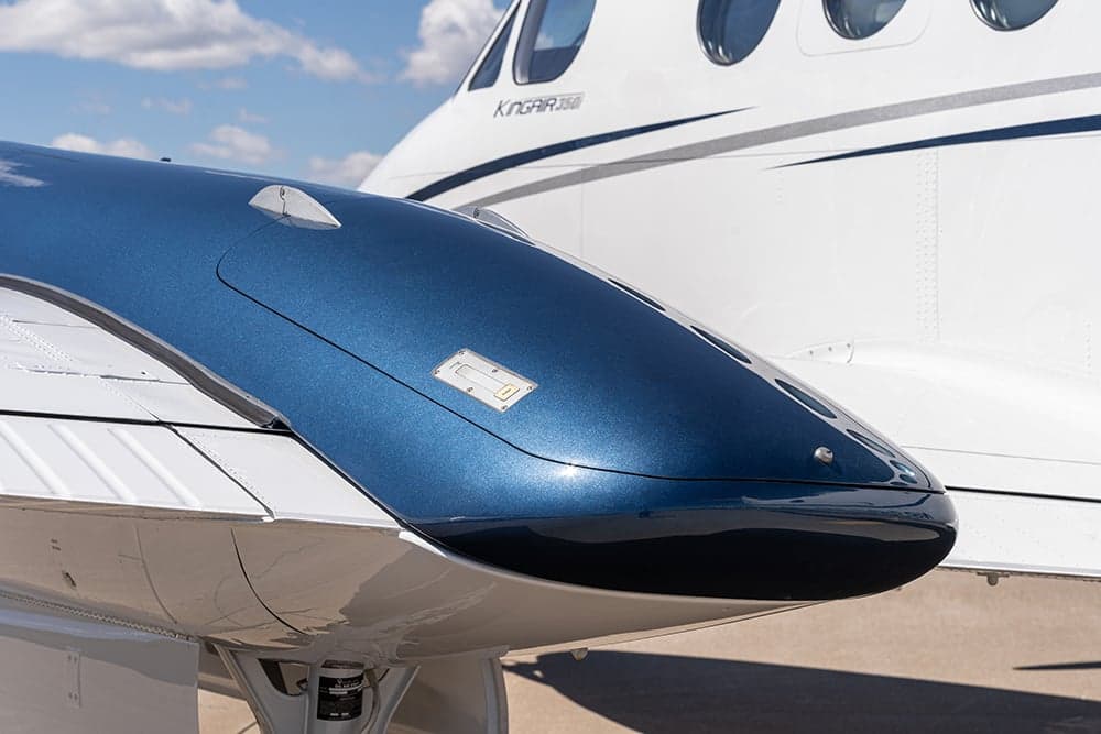 Close-up of the engine nacelle on a Beechcraft King Air 350i aircraft.