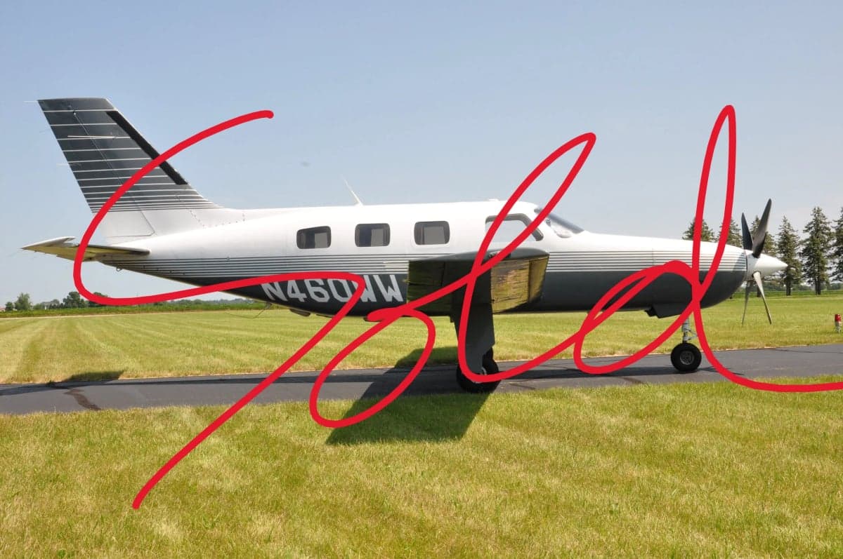 Side view of a Piper PA-46 Malibu Mirage with "SOLD" overlaid.