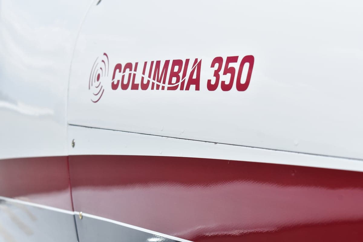 Side view of Columbia 350 aircraft N1170B on the tarmac.