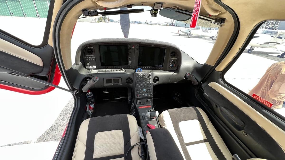 View of the cockpit instrument panel and seats.